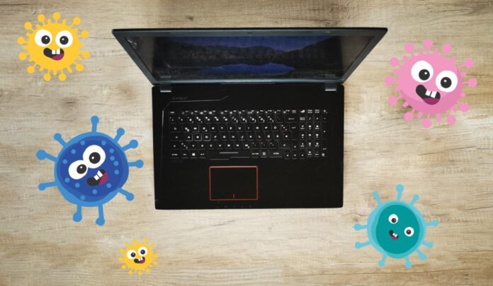 Laptop mit Corona-Grafiken
