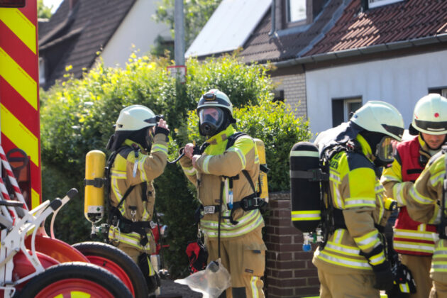 a group of firefighters wearing fire gear